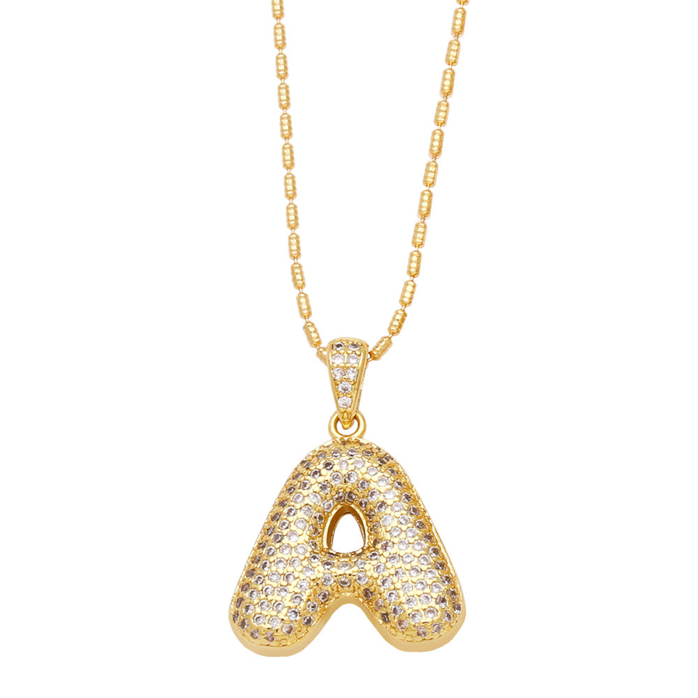 a bubble letter necklace gold 